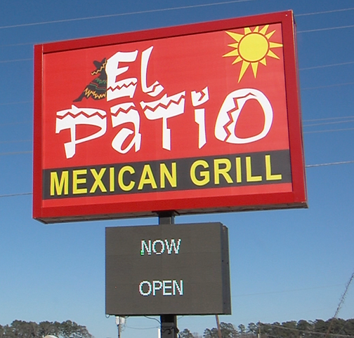 El Patio Now Open Sign Croped.png